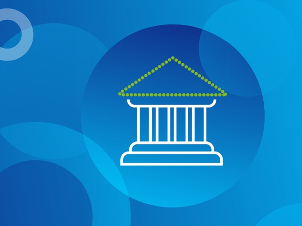 A white outline of a building with columns and a triangular roof is centered against a blue background. The roof is outlined with green dots. The background features various shades of blue circles and rings, some overlapping, creating a subtle pattern.