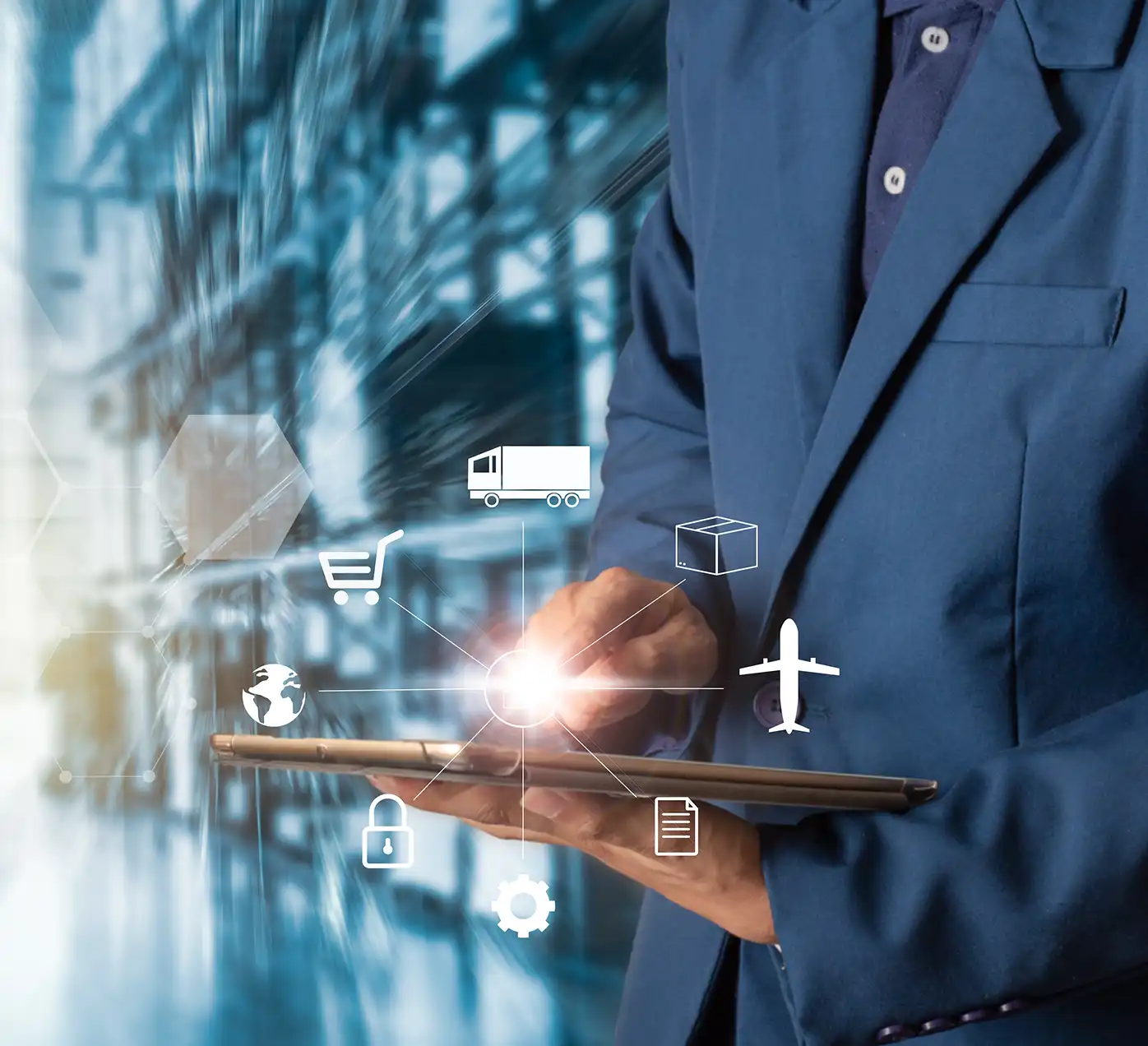 Image of a person holding a tablet in a warehouse.