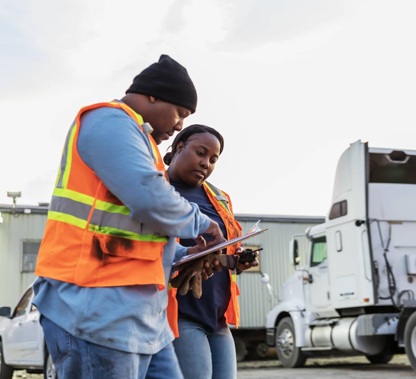 Transportation workers comparing notes