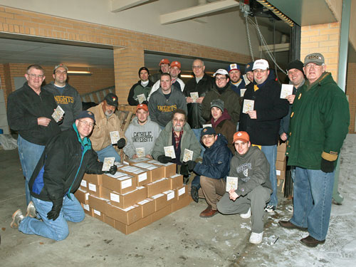 College Knights and K of C leaders from the Washington, D.C., area gather to prepare boxes of Armed with the Faith for shipment to U.S. military personnel stationed around the world in 2010.