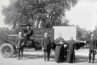 James J. Sexton (far left) delivers the foundation stone for the new national shrine to Bishop Thomas J. Shahan (second from right) and other dignitaries Sept. 19, 1920.