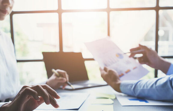 business people meeting to discuss and brainstorming the financial report paperwork in home office