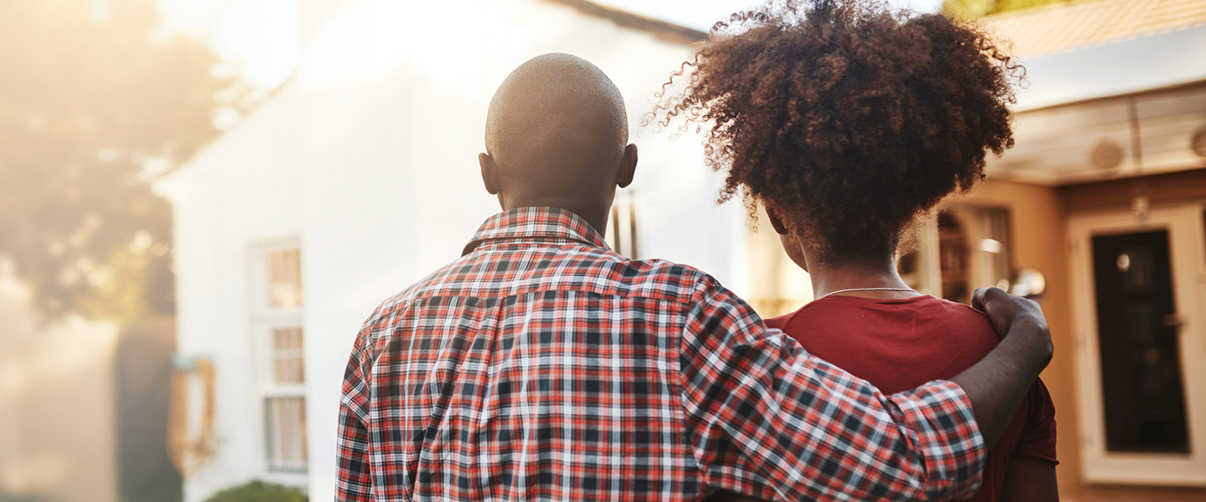  A couple standing in front of a home