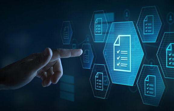 Finger pointing at a screen covered in digital badges