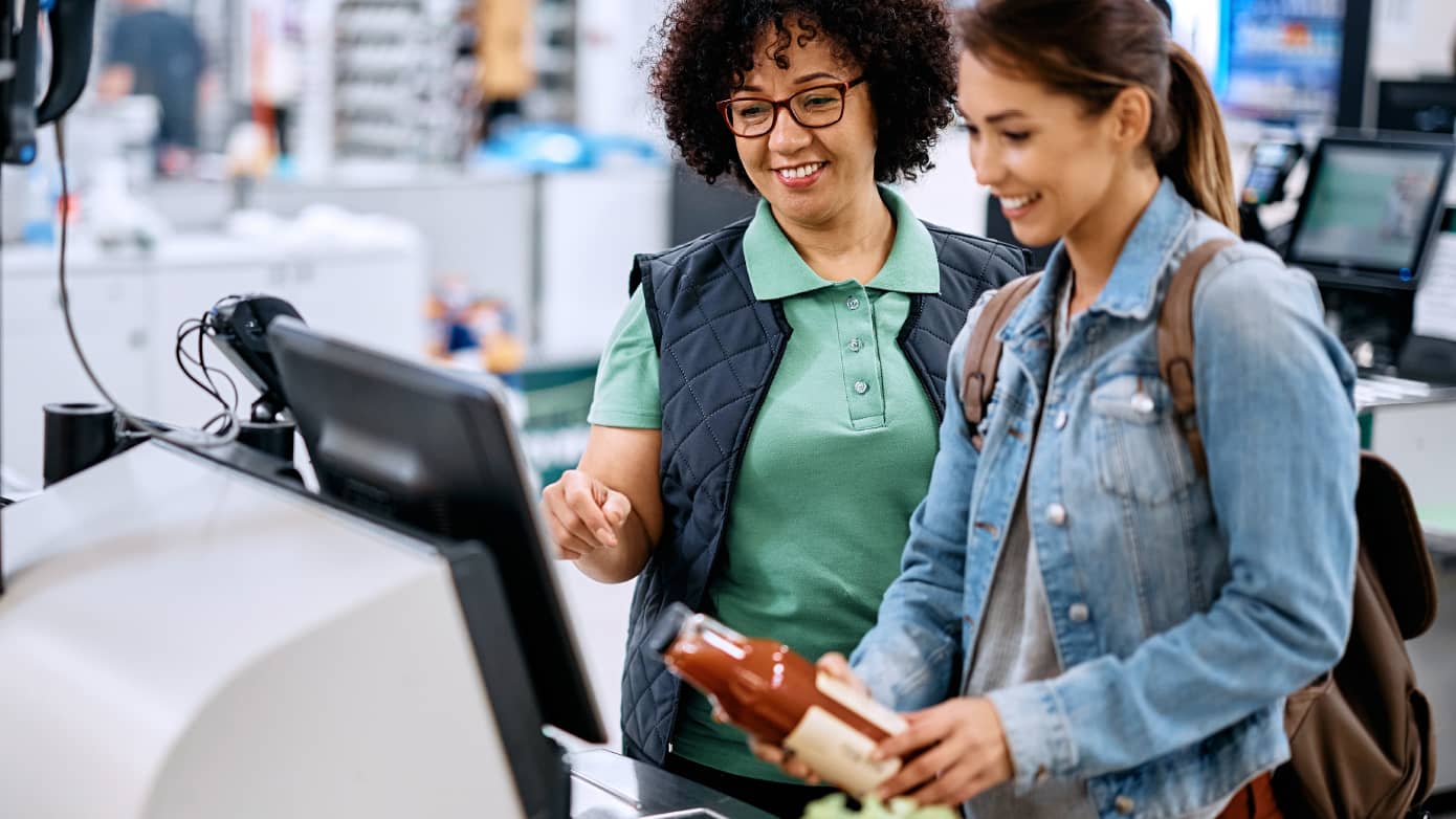 content-media-row the-evolving-role-of-the-store-associate.jpg Store associates looking at a store terminal