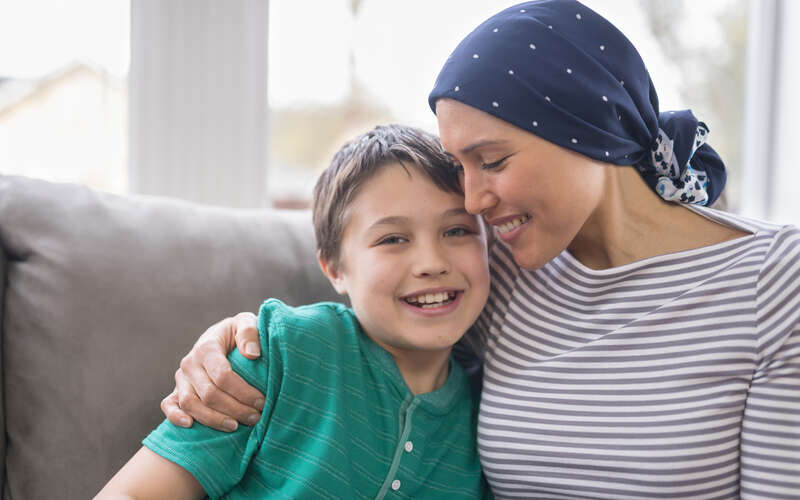 son with mom on couch