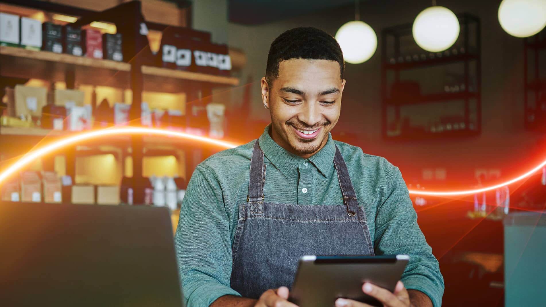 Image of a clerk holding an electronic tablet.