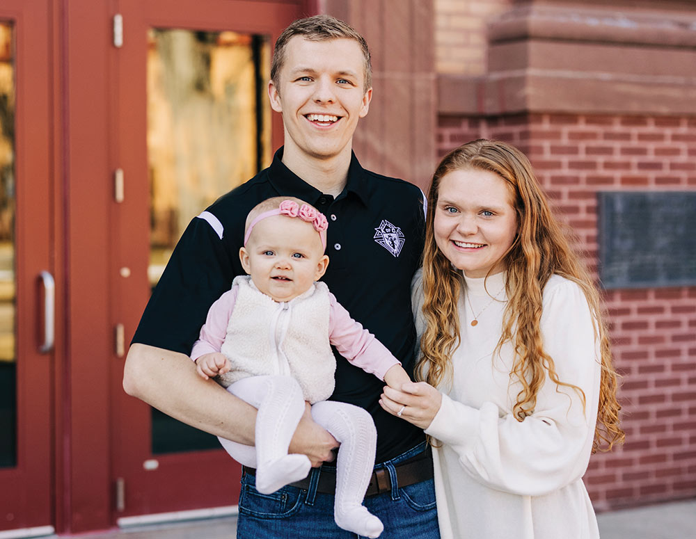 Aaron Filzen and his wife Shanna with their young child