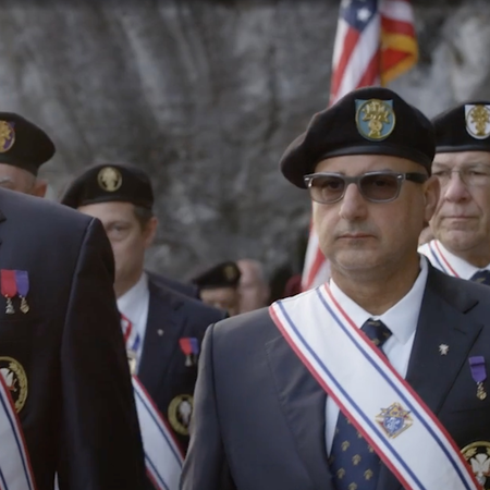 Fourth Degree members partake in a procession at the grotto in Lourdes, France.