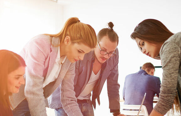 Group of people discussing work 