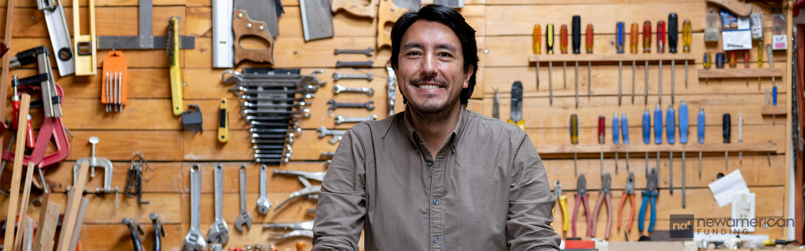 smiling man in his workshop