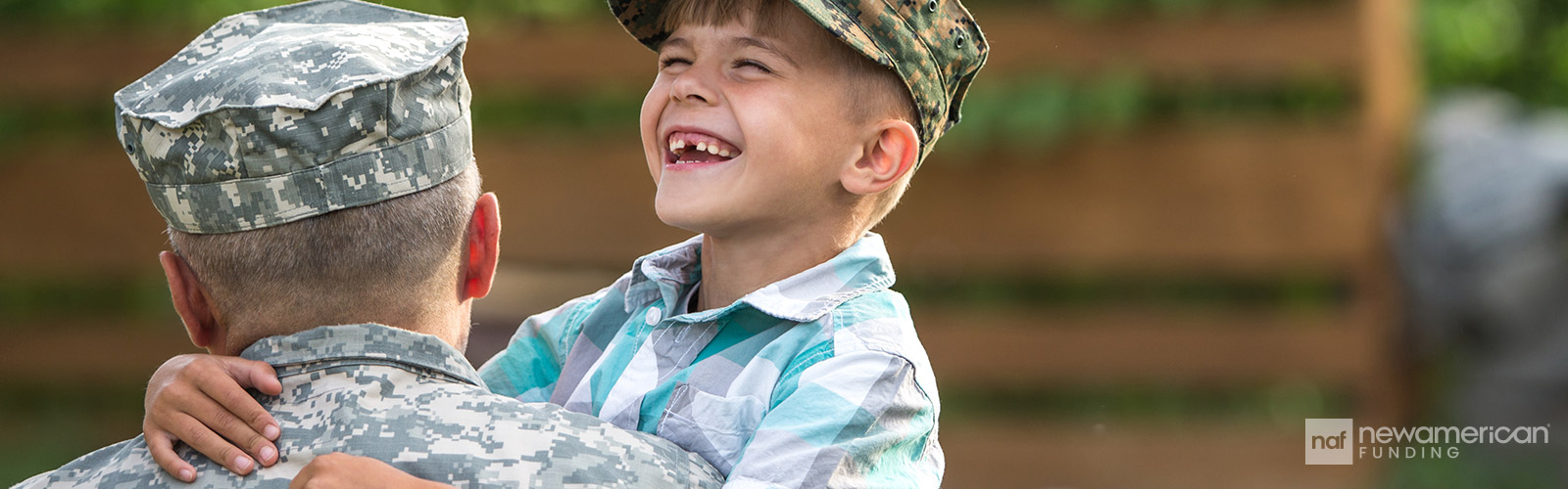 son happiliy hugging his military father