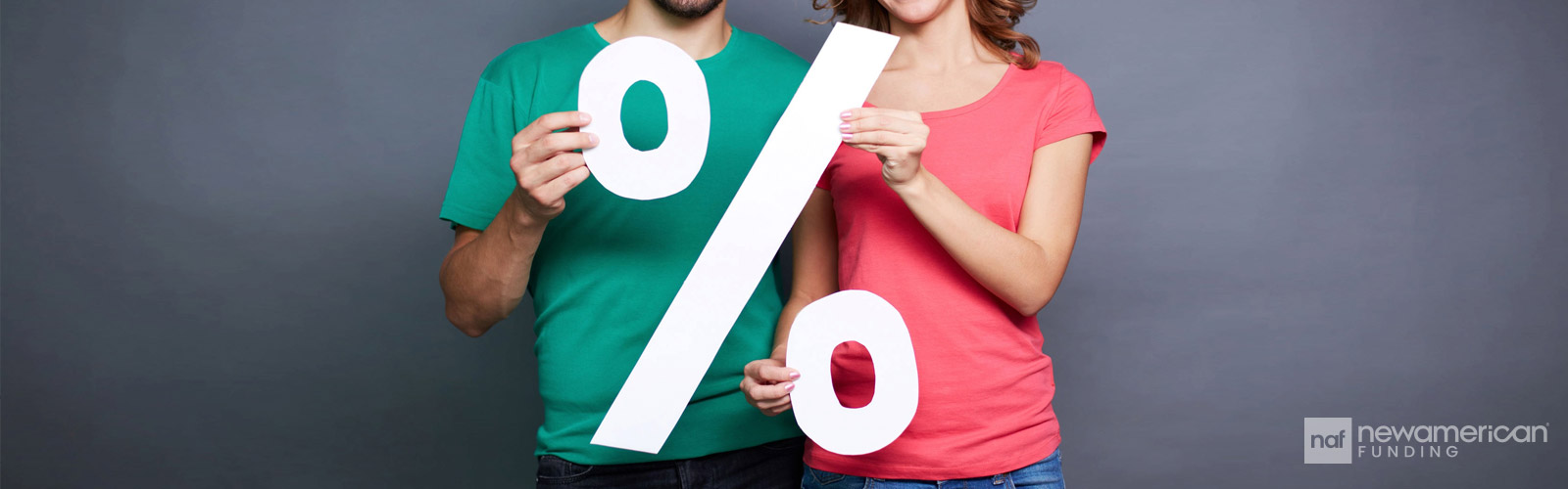 couple holding a percentage cutout