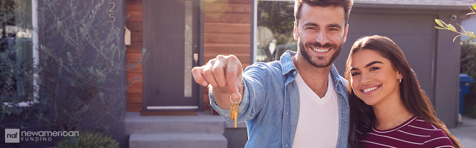 couple showing off their new house keys