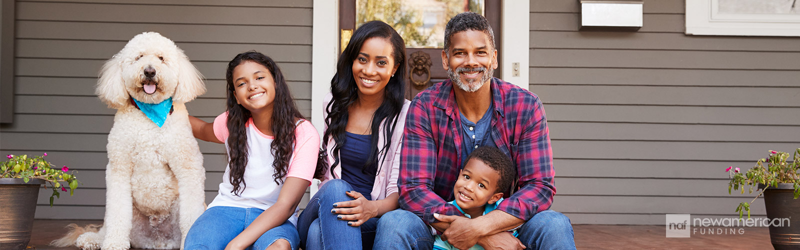 happy family sitting on their front stairs