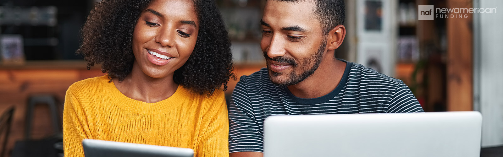 couple looking at a tablet