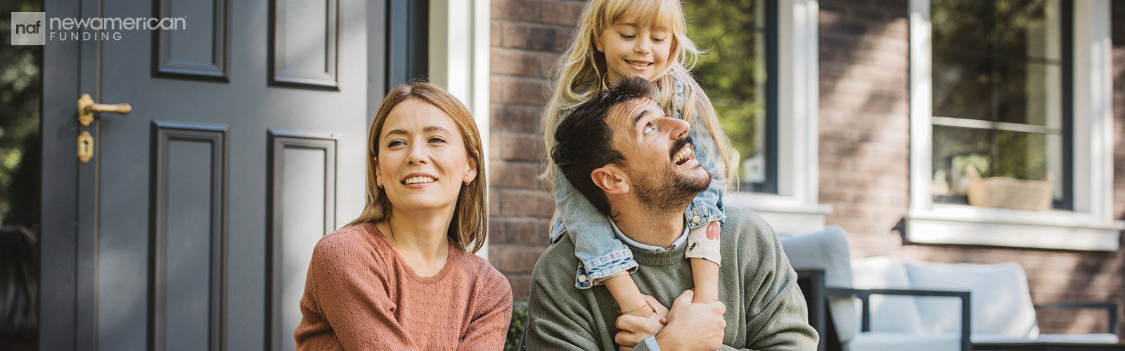 family sitting on their porch