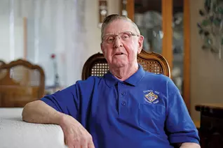 Chisholm, a Knight since 1960, sits at his home in Osage, Iowa. (Photo by Spirit Juice Studios)