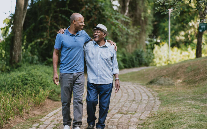 father and son walking on trail