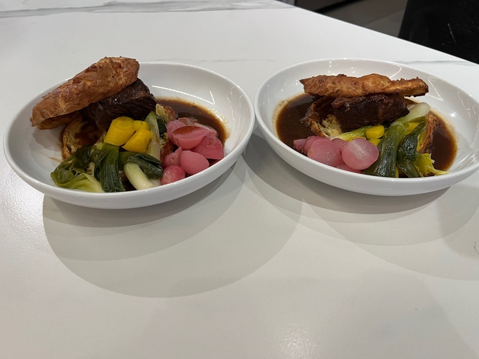 Two bowls of food on a tableDescription automatically generated