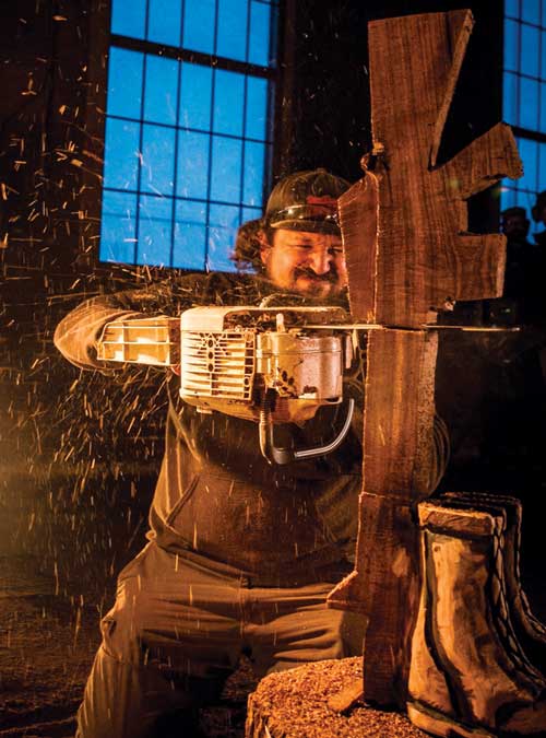 Marquez works on a battlefield cross in a warehouse in Tulsa, Okla. (Photo by Tom Harris)