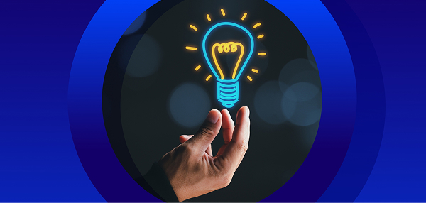 A hand holding up a glowing neon-blue and yellow line-art icon of a lightbulb, set against a dark, bokeh-filled background and framed by concentric blue circles.