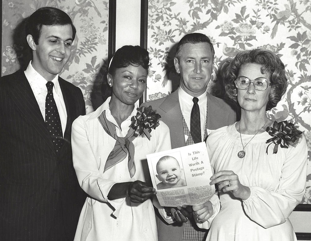 Anderson stands with pro-life champion Dr. Mildred Jefferson at the fourth annual state convention of North Carolina Right to Life, Inc., in 1977. Also pictured are convention committee members Bill Eastwood and Emma O&rsquo;Steen.