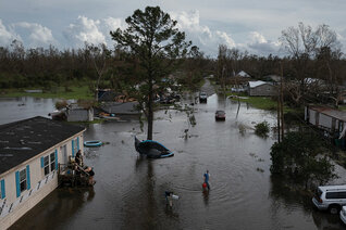 A man walks to his home in Cut Off, a small town in southeastern Louisiana