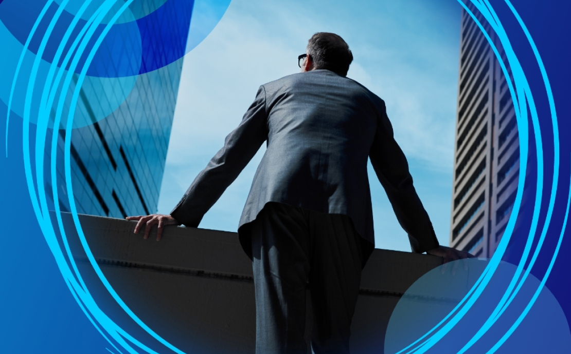 Man staring into the distance in a suit.