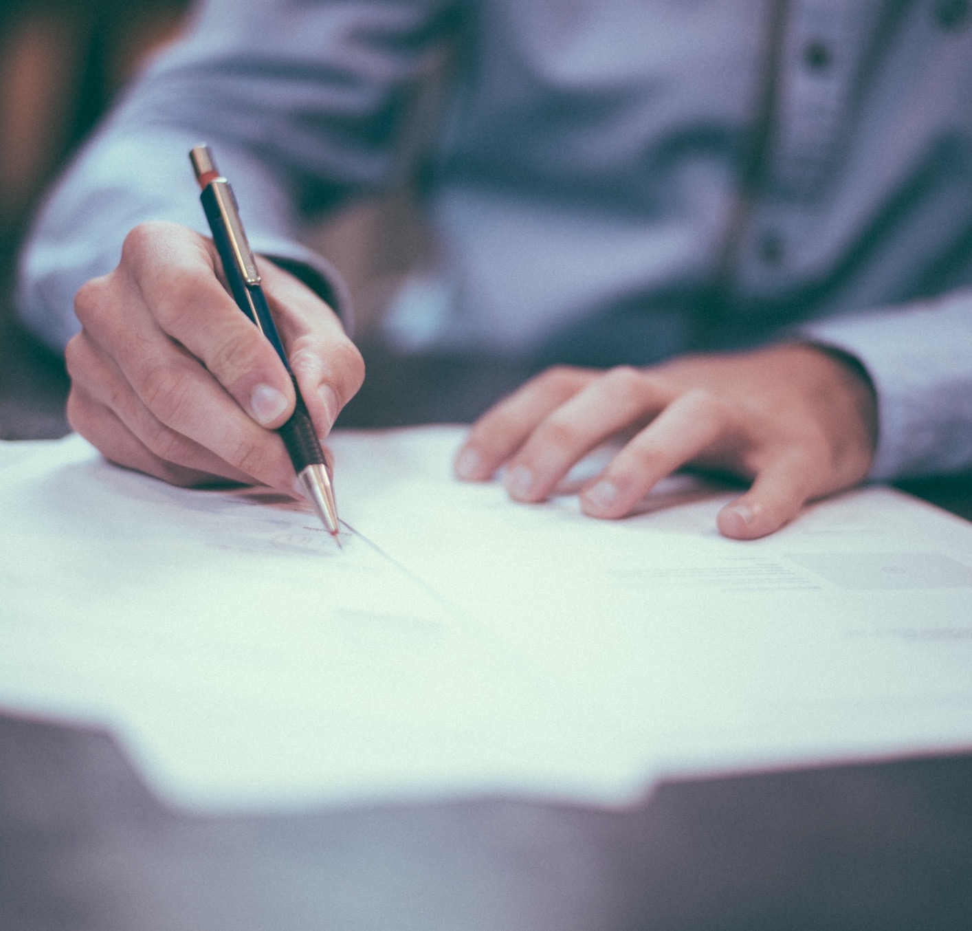lawyer signing a document