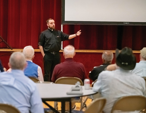 Father Nicholas Stano, chaplain of Concord (Mass.) Council 287 and St. Irene Council 13848 in Carlisle, speaks during the councils&rsquo; joint Cor gathering May 21. (Photo by Bryce Vickmark)