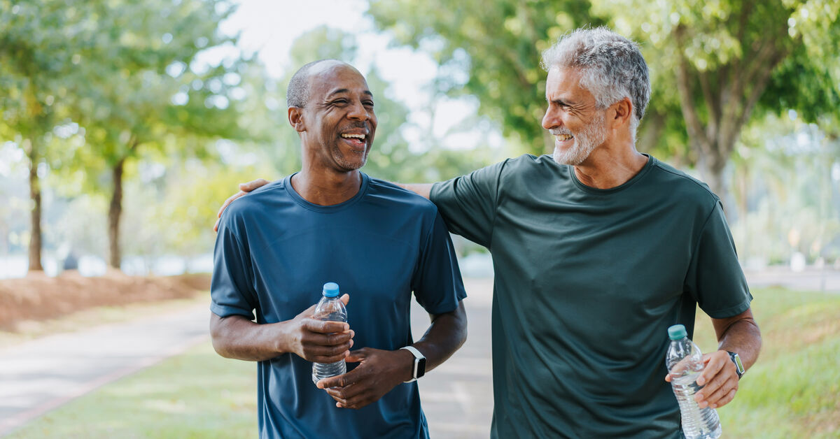 two men walking on exercise trail