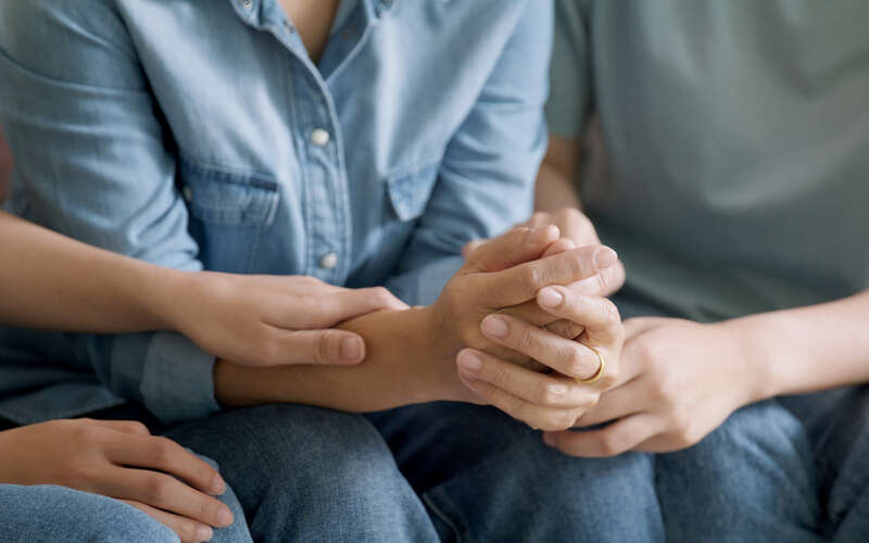 Middle aged old mom crying grief loss tired hold hand stress relief talk with love care at home. Young woman listen to older mum pain sad worry lost in life crisis issues.