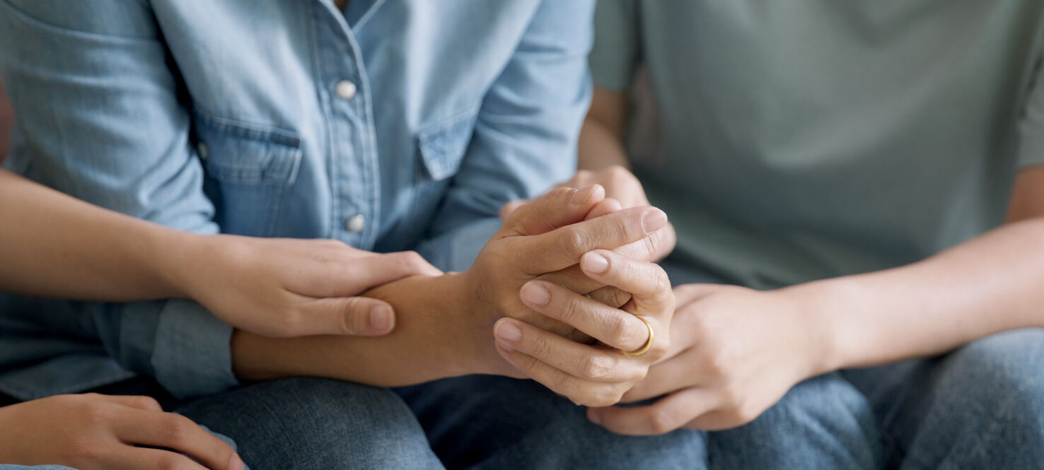 Middle aged old mom crying grief loss tired hold hand stress relief talk with love care at home. Young woman listen to older mum pain sad worry lost in life crisis issues.