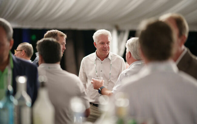 Casual business people conversating at conference reception
