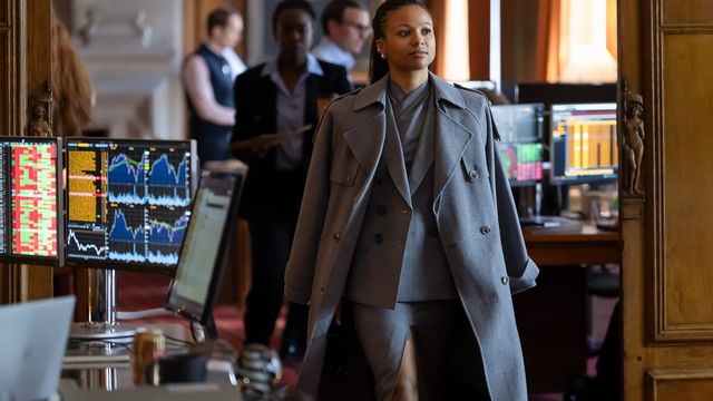 Myha’la Herrold as Harper Stern walking confidently through a trading floor