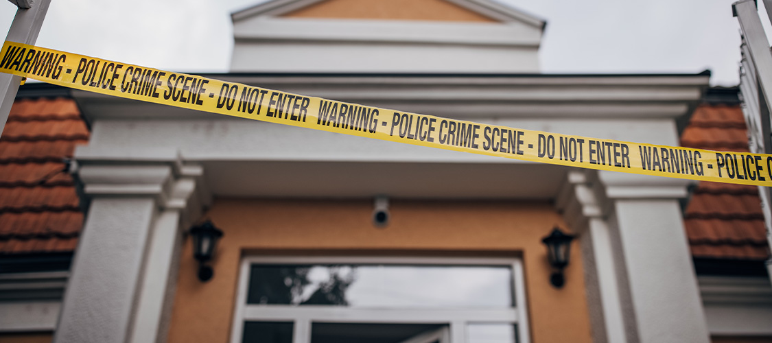 a home with crime scene tape