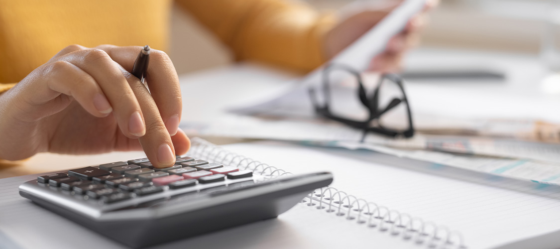 A person using a calculator