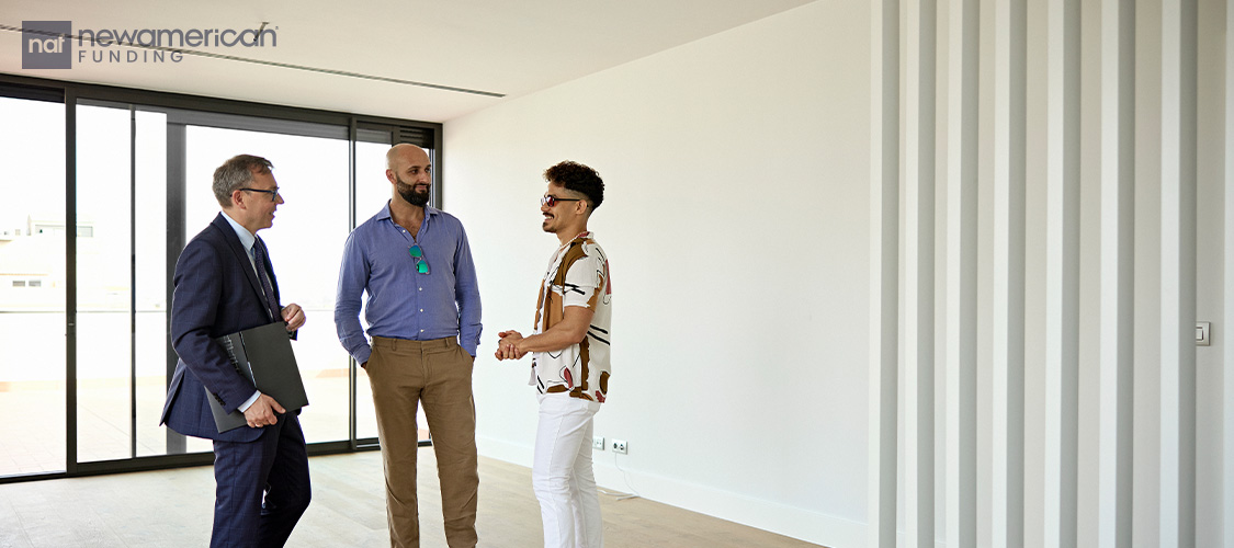 A couple touring an empty home.