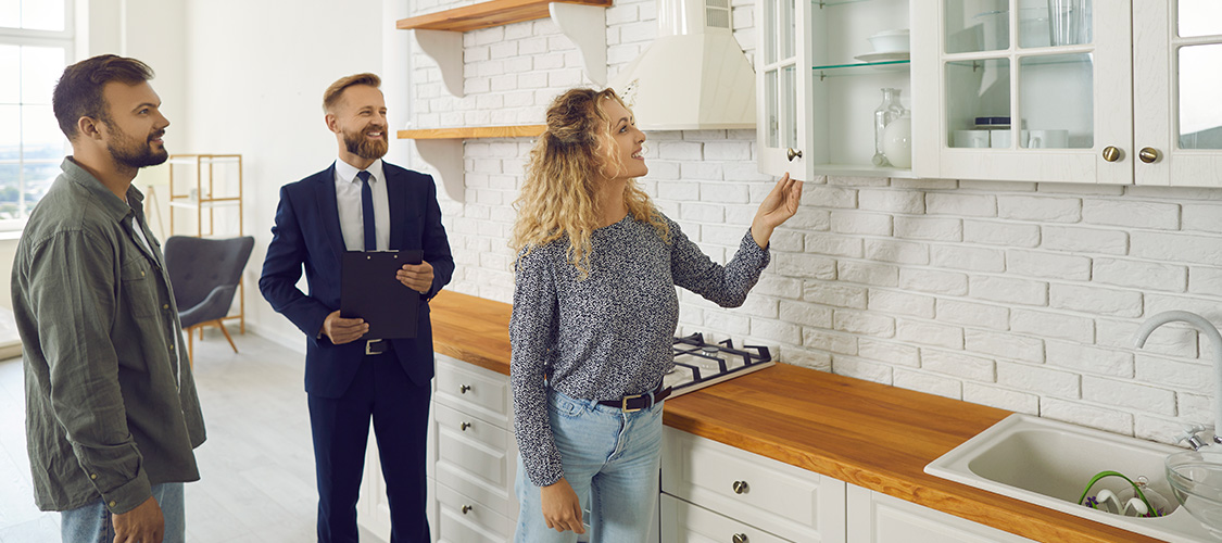 Woman looking at kitchen cabinets