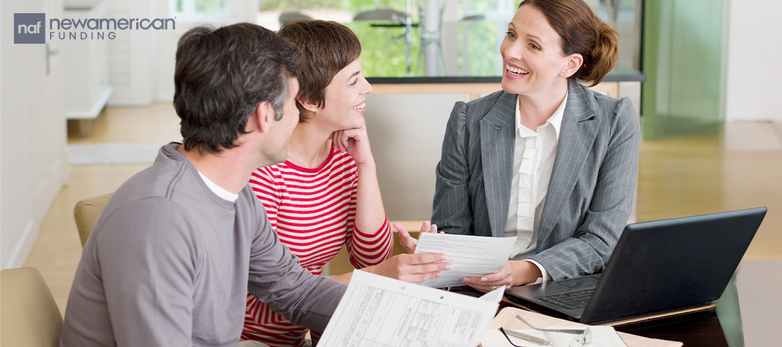 A couple meeting with a loan officer.