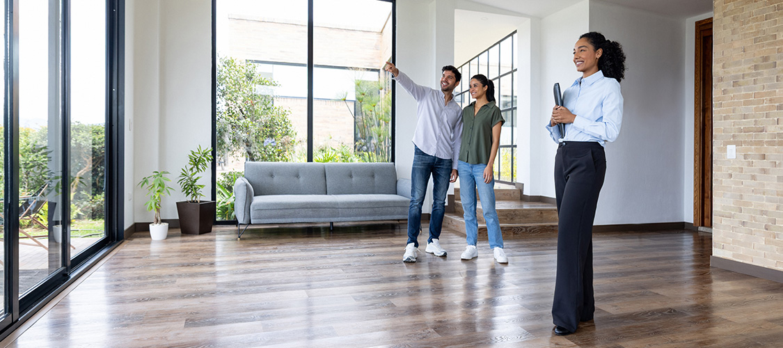 Couple touring a new home for sale