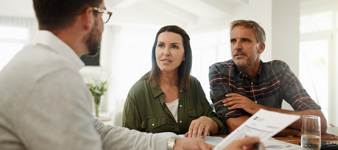 someone meeting with a loan officer to go over their loan