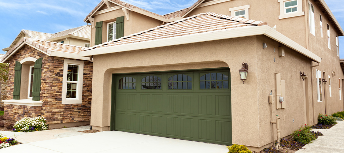 Home with green garage door