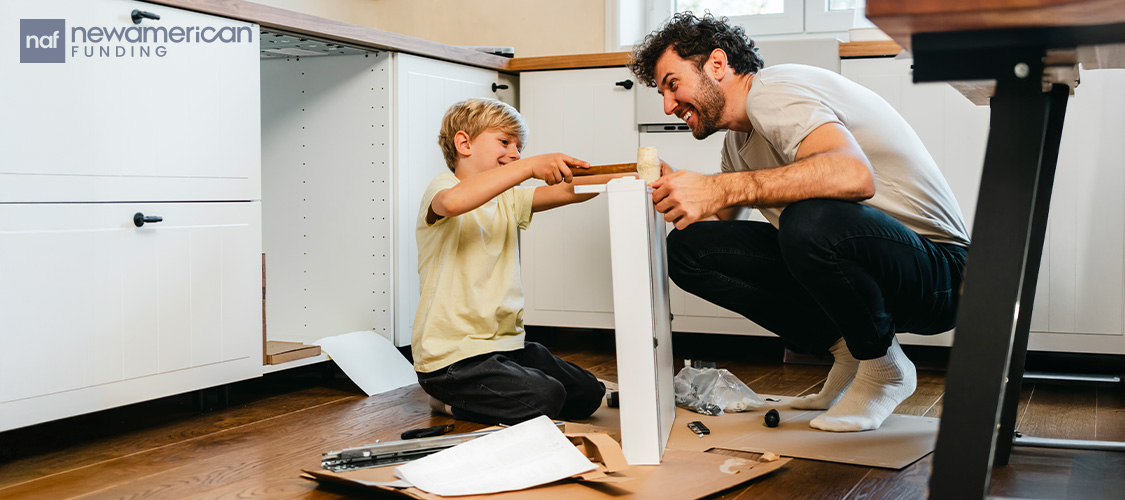 A man and a small boy doing repair work in a home.