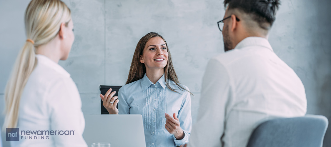 A couple meeting with a loan officer.