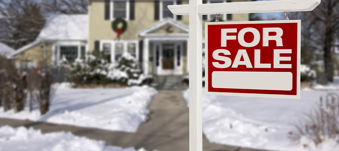 Home for sale with snow on the ground