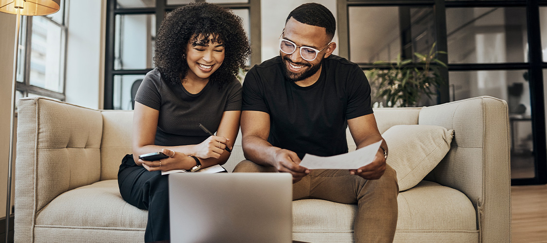 : A homeowner looking at their bank account or credit score