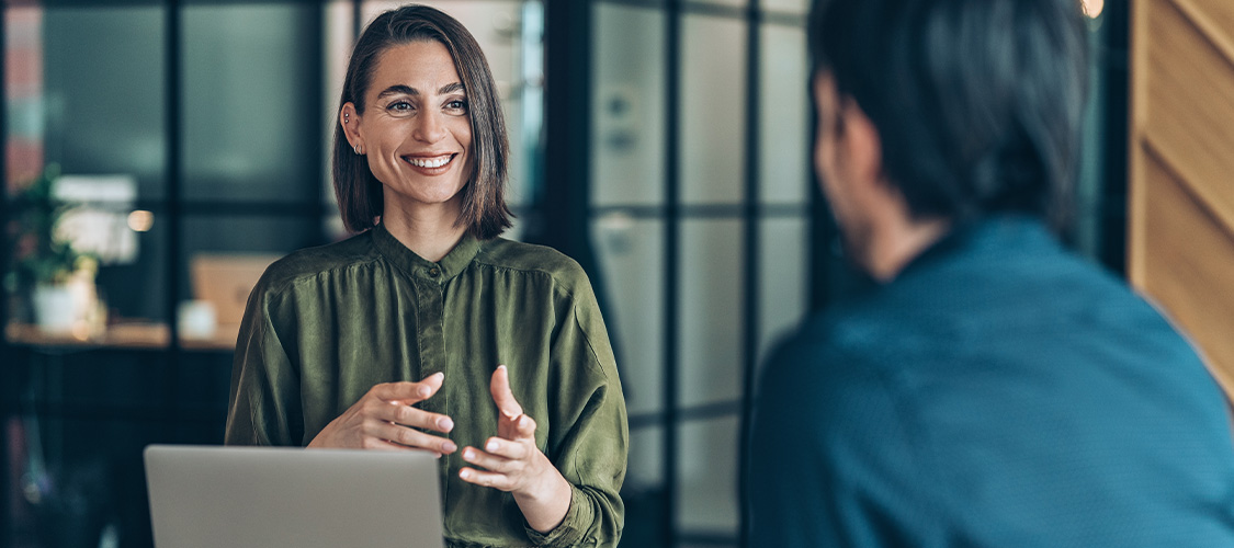 A man talking to a loan officer.