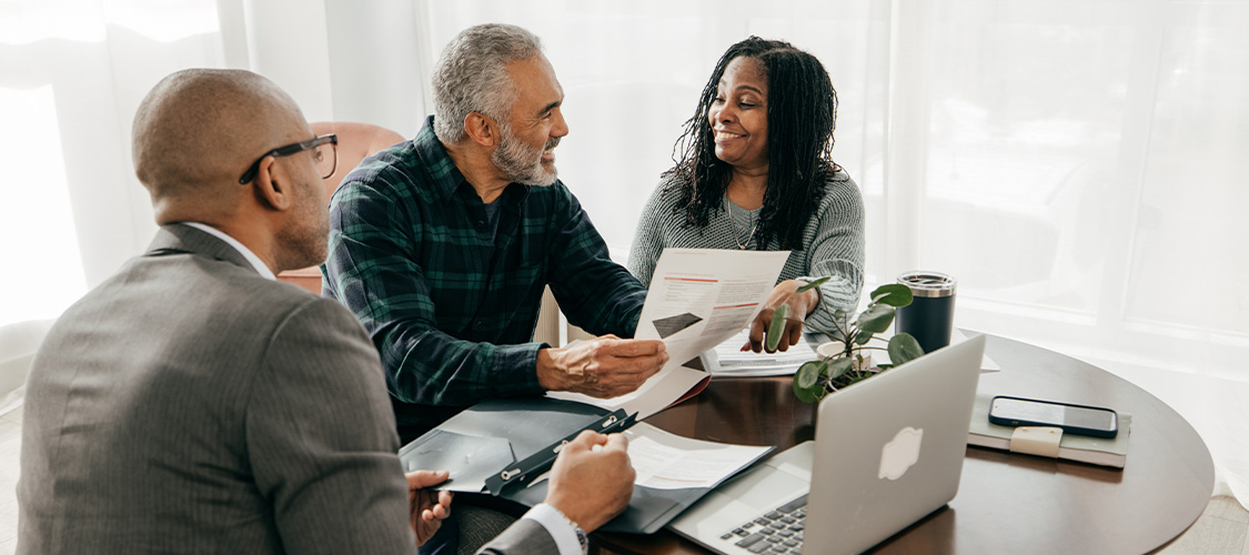Older couple speaking with a Loan Officer